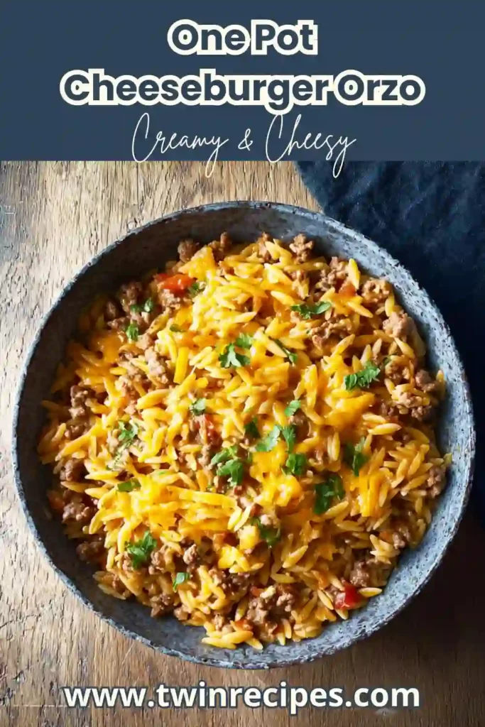 One pot cheeseburger orzo skillet with melted cheddar and parsley garnish.