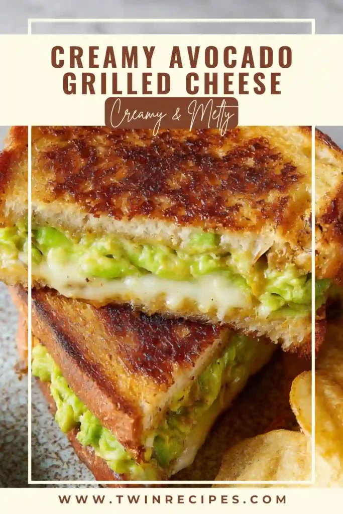“A warm avocado grilled cheese cut in half, showing melted cheese and creamy avocado, great for an avocado recipes lunch idea.”