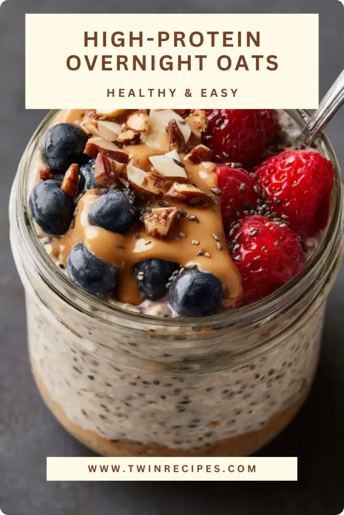 Breakfast table with overnight oats jar, fresh raspberries, almond milk jug and a spoon ready to dig in.