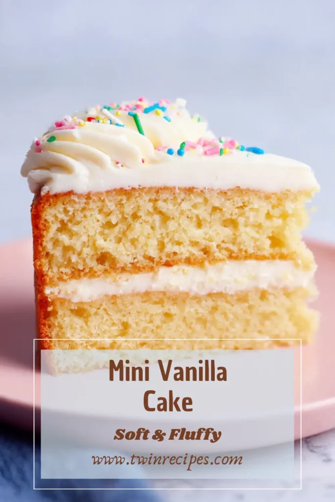 A single-layer mini vanilla cake sliced open to reveal soft texture.
